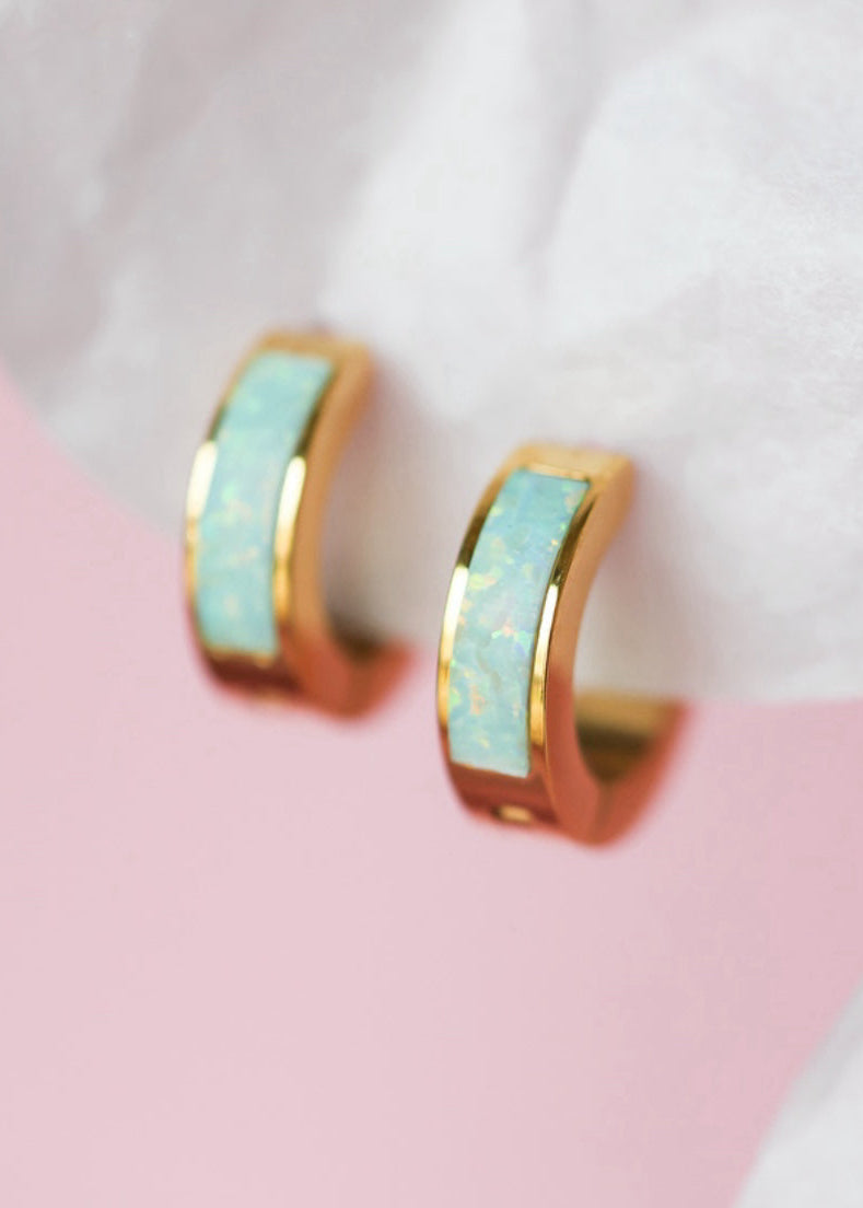 Gold hoops with blue opal inlay