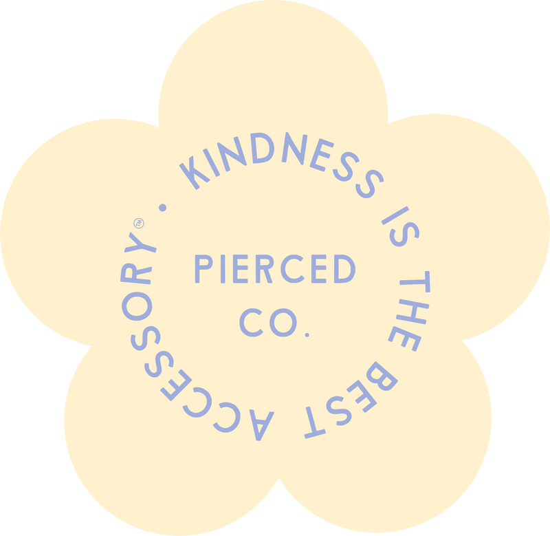 Round yellow sticker with blue text 'Kindness is the Best Accessory' on a white background