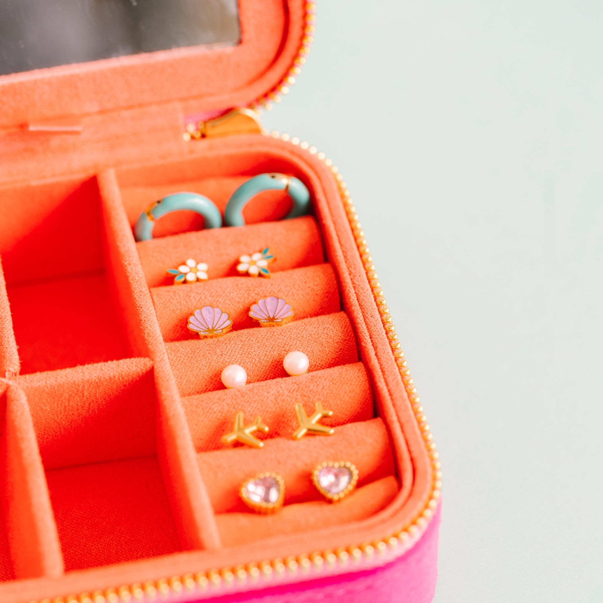 Travel Jewelry Box Open with earrings in its earring slots Close up