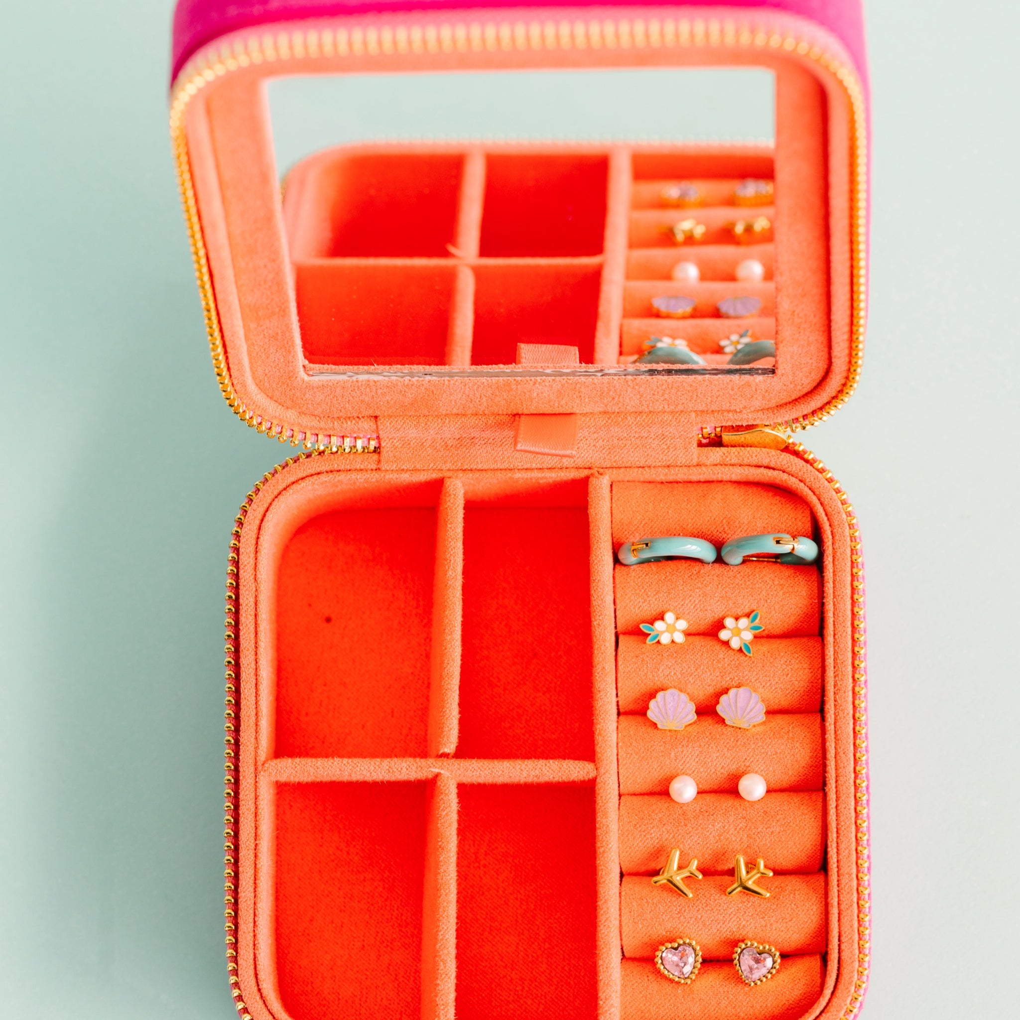 Travel Jewelry Box Open with earrings in its earring slots View from above