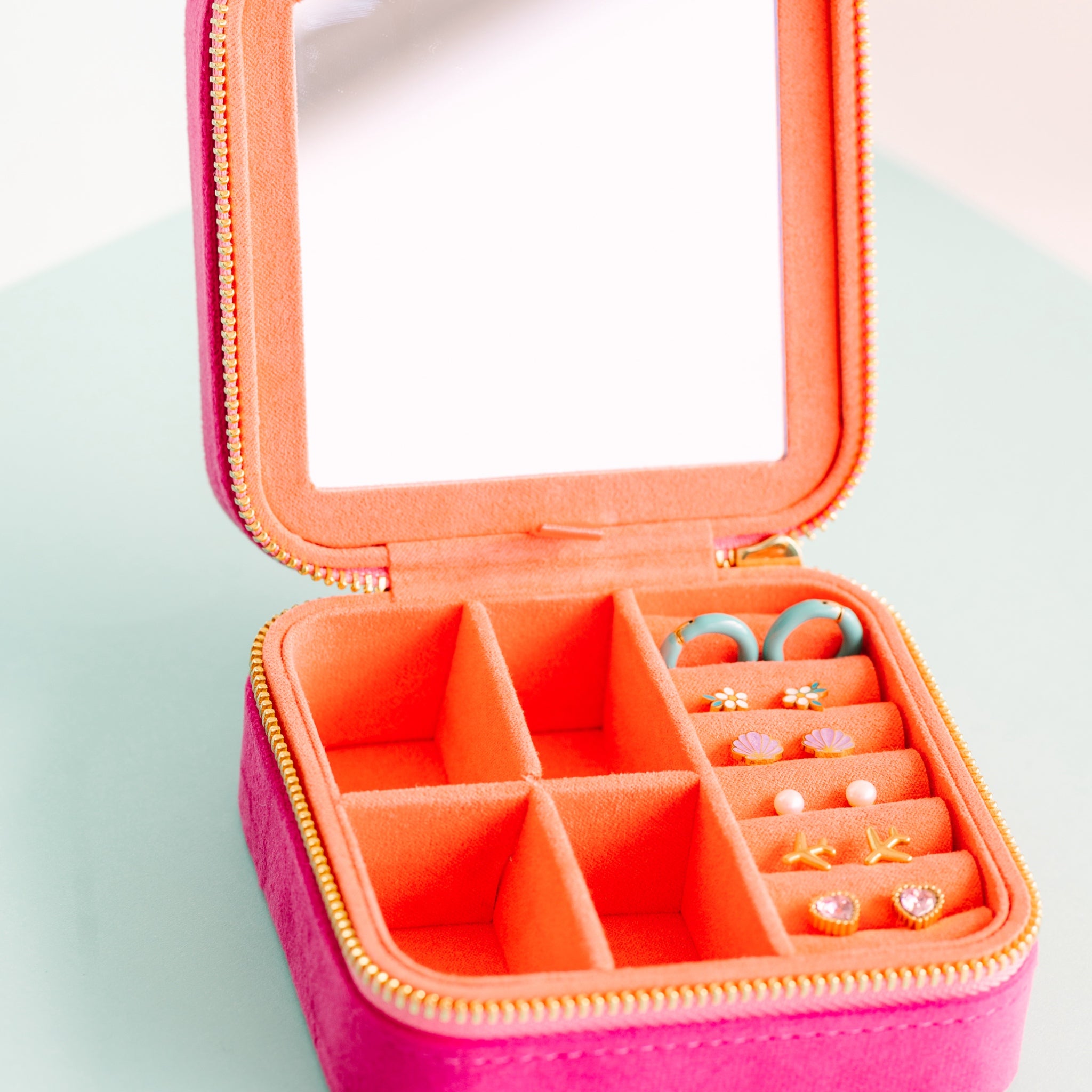 Travel Jewelry Box Open with earrings in its earring slots