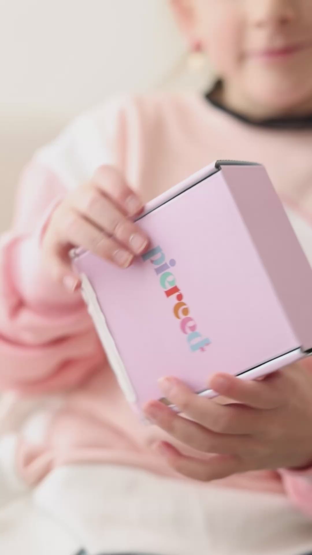 Video of girl opening pierced box subscription
